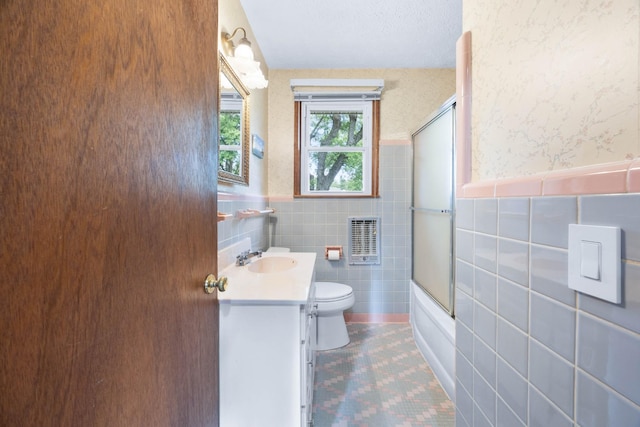 19 Garth Dr, Clarksville, TN 37040 - full bathroom featuring vanity, tile walls, tile patterned floors, a wainscoted wall, and enclosed tub / shower combo