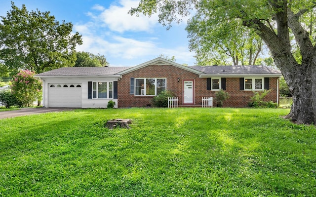 19 Garth Dr, Clarksville, TN 37040 - ranch-style home with a garage, asphalt driveway, brick siding, and a front lawn