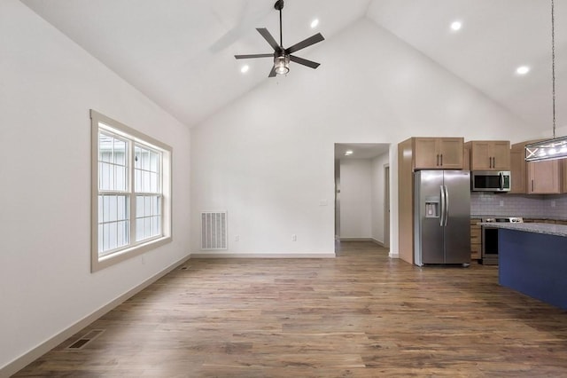 130 Rachelle Pl, Baxter, TN 38544 - kitchen with appliances with stainless steel finishes, high vaulted ceiling, ceiling fan, recessed lighting, and tasteful backsplash