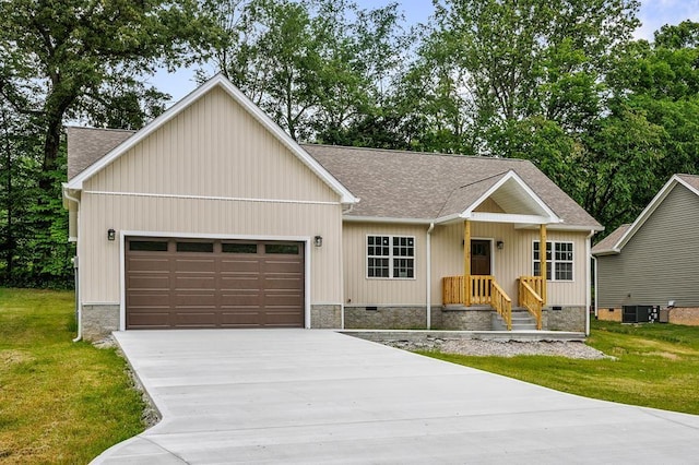 130 Rachelle Pl, Baxter, TN 38544 - view of front of property featuring roof with shingles, an attached garage, concrete driveway, and a front yard