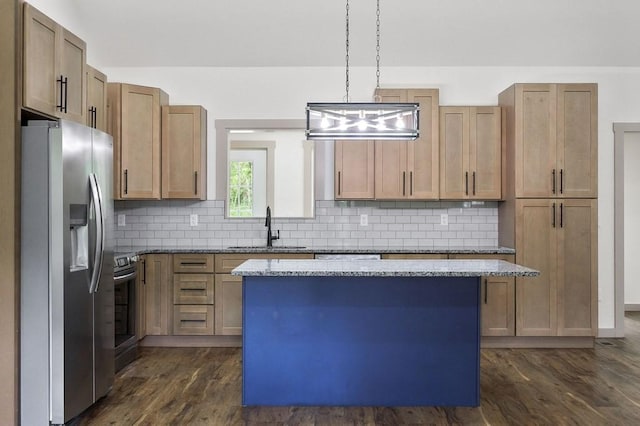 130 Rachelle Pl, Baxter, TN 38544 - kitchen featuring appliances with stainless steel finishes, dark wood-style flooring, tasteful backsplash, and a kitchen island