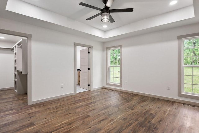 130 Rachelle Pl, Baxter, TN 38544 - unfurnished bedroom with a tray ceiling, a spacious closet, wood finished floors, recessed lighting, and ensuite bathroom