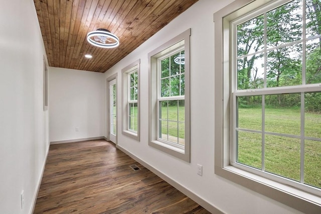 130 Rachelle Pl, Baxter, TN 38544 - empty room featuring healthy amount of natural light, wood ceiling, and dark wood finished floors