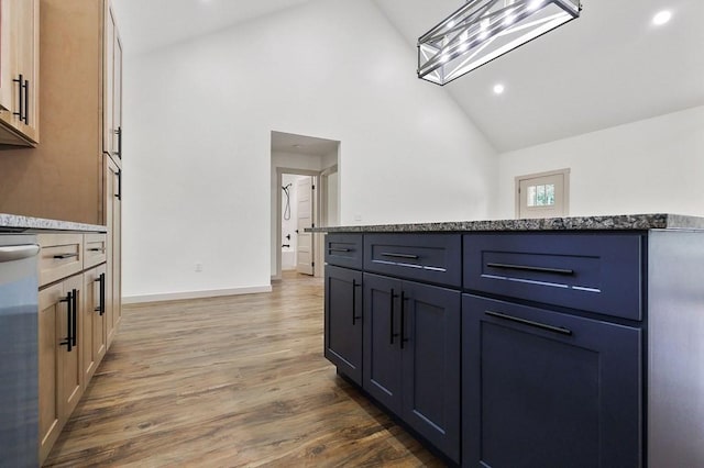 130 Rachelle Pl, Baxter, TN 38544 - kitchen featuring wood finished floors, light stone counters, high vaulted ceiling, and recessed lighting