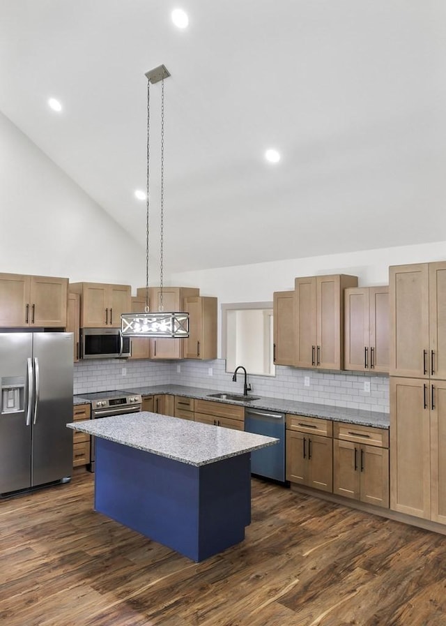 130 Rachelle Pl, Baxter, TN 38544 - kitchen with appliances with stainless steel finishes, a kitchen island, backsplash, lofted ceiling, and light stone countertops