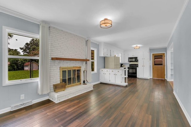 1118 Houston Dr, Murfreesboro, TN 37130 - unfurnished living room with dark wood-type flooring, a brick fireplace, and ornamental molding