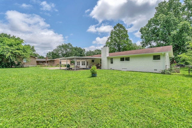 1118 Houston Dr, Murfreesboro, TN 37130 - back of property featuring a chimney, a patio area, crawl space, and brick siding