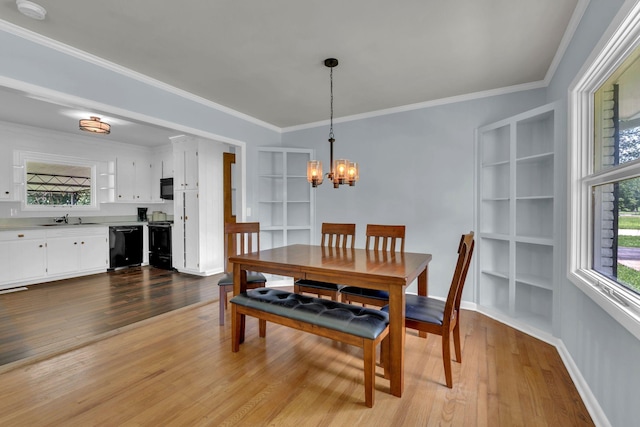 1118 Houston Dr, Murfreesboro, TN 37130 - dining space with a chandelier, light wood-type flooring, healthy amount of natural light, and crown molding