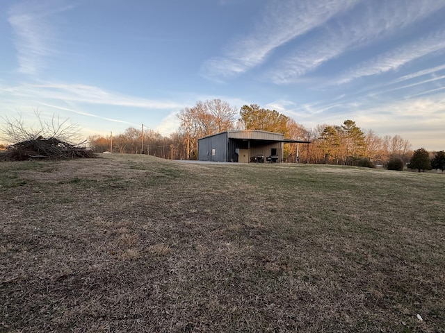 342 Second Creek Rd, Five Points, TN 38457 - view of green lawn with a pole building, an outbuilding, and a carport