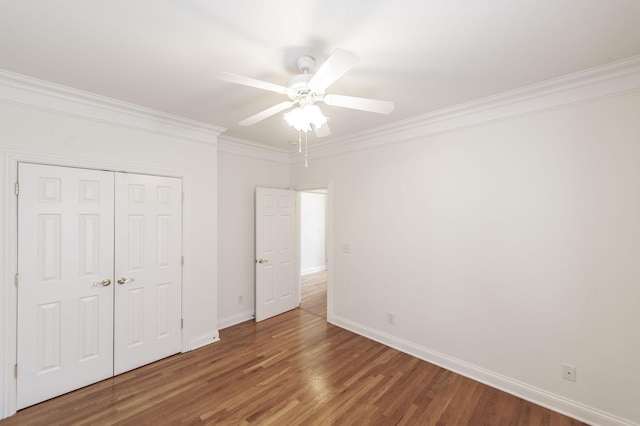 1176 Fairvue Village Ln, Gallatin, TN 37066 - unfurnished bedroom with ornamental molding, wood finished floors, a closet, and a ceiling fan