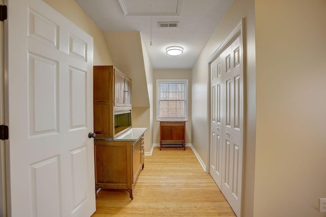 1064 Crane Ct, Kingston Springs, TN 37082 - hallway featuring attic access and light wood-style floors