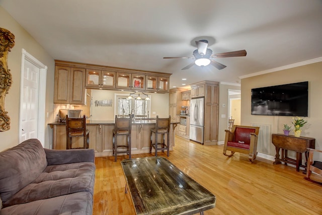 1064 Crane Ct, Kingston Springs, TN 37082 - living room featuring ceiling fan, light wood-style floors, and crown molding