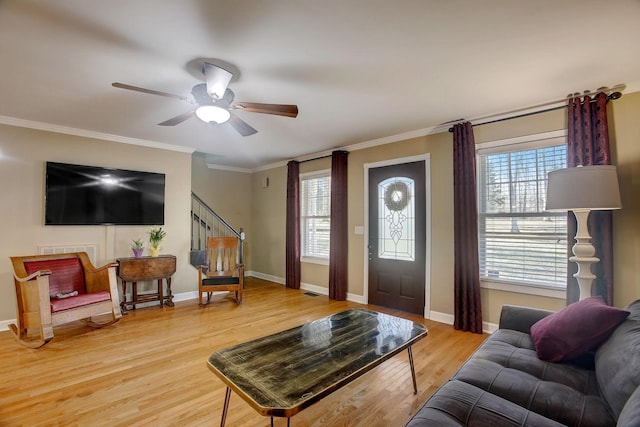 1064 Crane Ct, Kingston Springs, TN 37082 - living room featuring stairs, light wood-type flooring, ornamental molding, and a ceiling fan