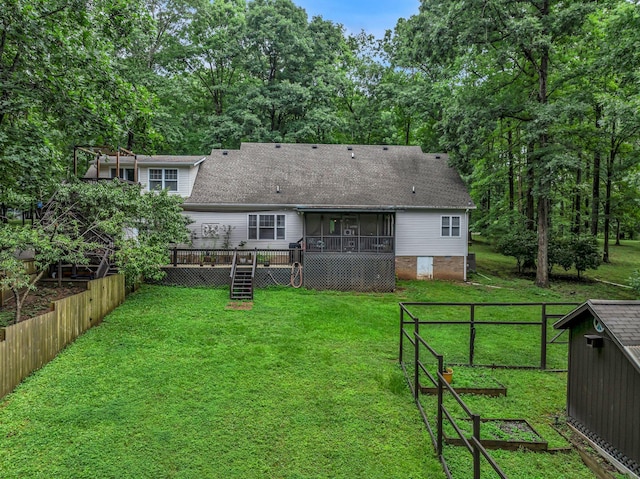 1064 Crane Ct, Kingston Springs, TN 37082 - rear view of property featuring a sunroom, a shingled roof, and a garden