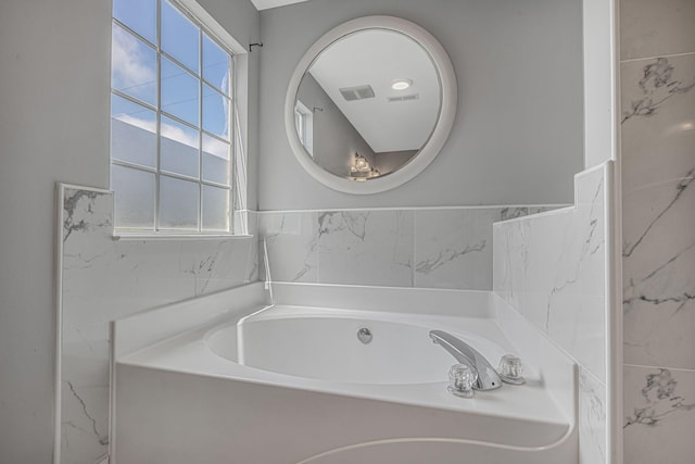 1220 Kelly Ct, Franklin, TN 37064 - bathroom with a garden tub and healthy amount of natural light