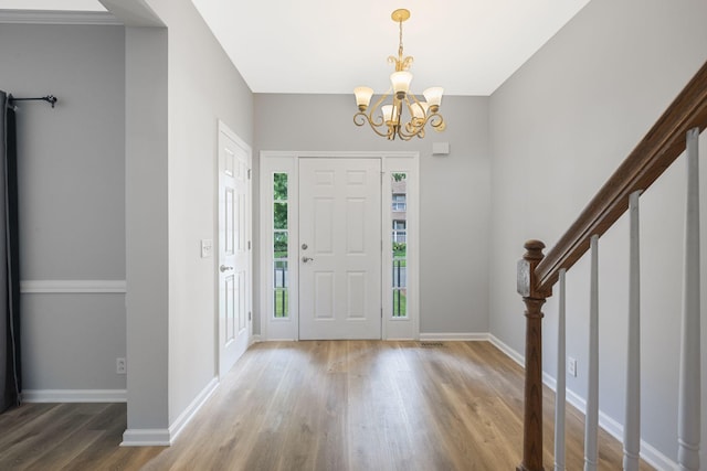 1220 Kelly Ct, Franklin, TN 37064 - entryway with wood finished floors, a chandelier, and stairway