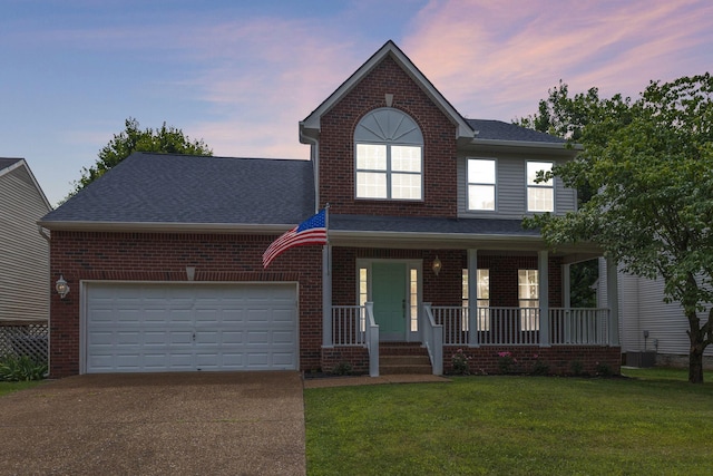 1220 Kelly Ct, Franklin, TN 37064 - traditional-style home with concrete driveway, a porch, an attached garage, a yard, and brick siding