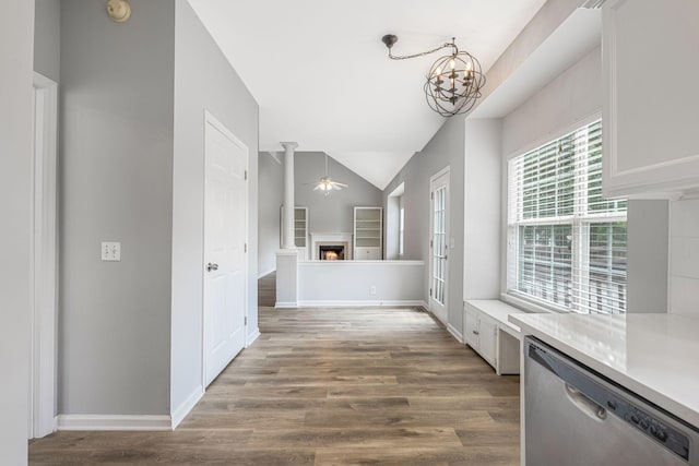 1220 Kelly Ct, Franklin, TN 37064 - corridor with built in shelves, wood finished floors, lofted ceiling, and a chandelier