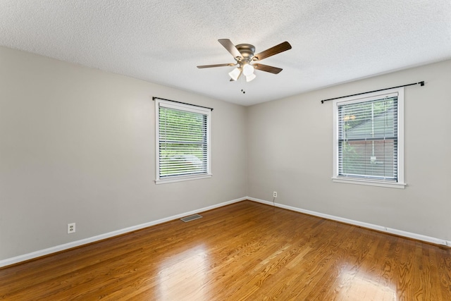 2709 Emery Dr, Nashville, TN 37214 - unfurnished room featuring wood finished floors, ceiling fan, plenty of natural light, and a textured ceiling