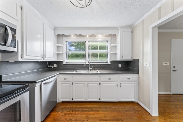 2709 Emery Dr, Nashville, TN 37214 - kitchen featuring open shelves, stainless steel appliances, dark countertops, ornamental molding, and white cabinetry