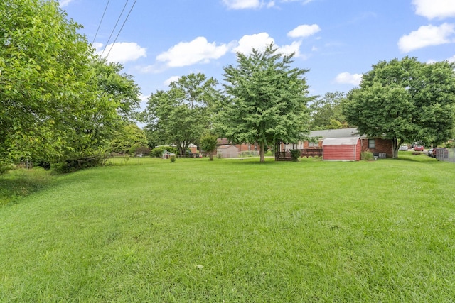 2709 Emery Dr, Nashville, TN 37214 - view of green lawn with a storage shed