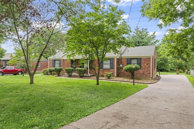 2709 Emery Dr, Nashville, TN 37214 - view of front of home with driveway, brick siding, a front lawn, and a shingled roof