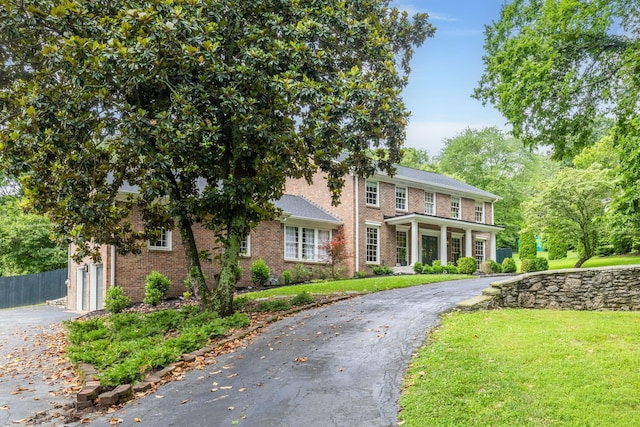 1231 Carl Seyfert Memorial Dr, Brentwood, TN 37027 - view of front of property featuring asphalt driveway, brick siding, and a garage