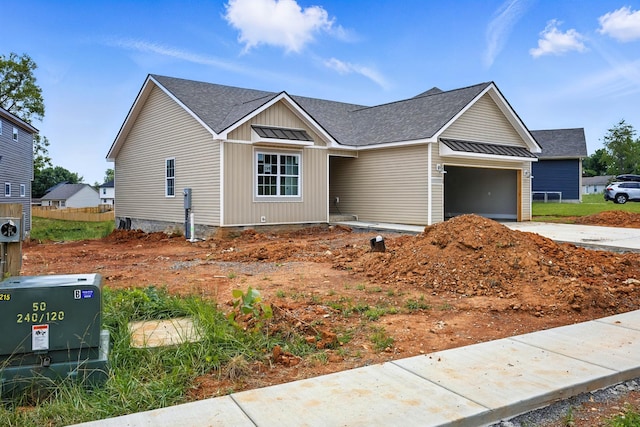 2670 Scott Dr, Clarksville, TN 37042 - view of front of home with an attached garage, concrete driveway, a shingled roof, and board and batten siding