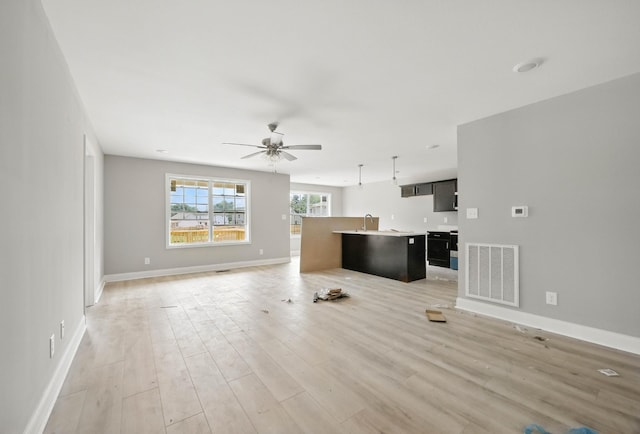 2670 Scott Dr, Clarksville, TN 37042 - unfurnished living room with ceiling fan and light wood-style floors