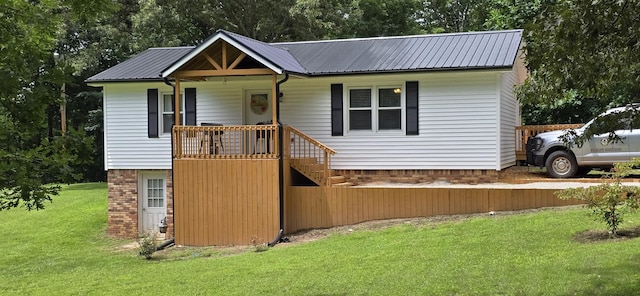 60 Jayson St, Camden, TN 38320 - view of front of property featuring a front lawn, a metal roof, and stairway