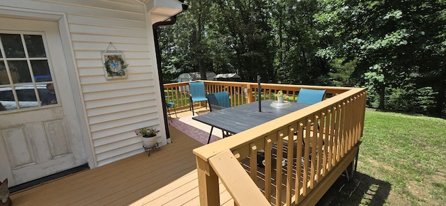 60 Jayson St, Camden, TN 38320 - wooden terrace with outdoor dining space and a lawn