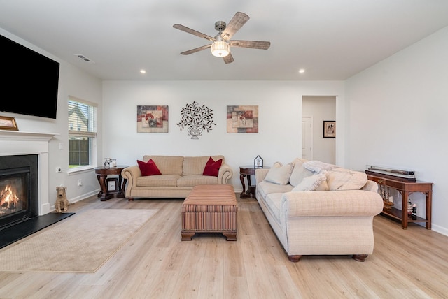 468 Rosy Dale Dr, Gallatin, TN 37066 - living room featuring light wood-type flooring, recessed lighting, a glass covered fireplace, and a ceiling fan