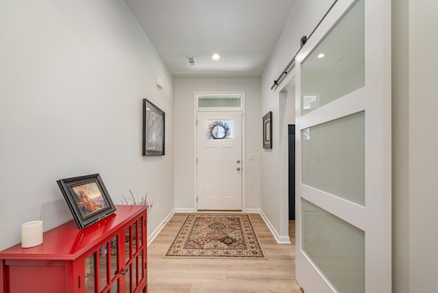 468 Rosy Dale Dr, Gallatin, TN 37066 - foyer with light wood-style flooring, a barn door, and recessed lighting