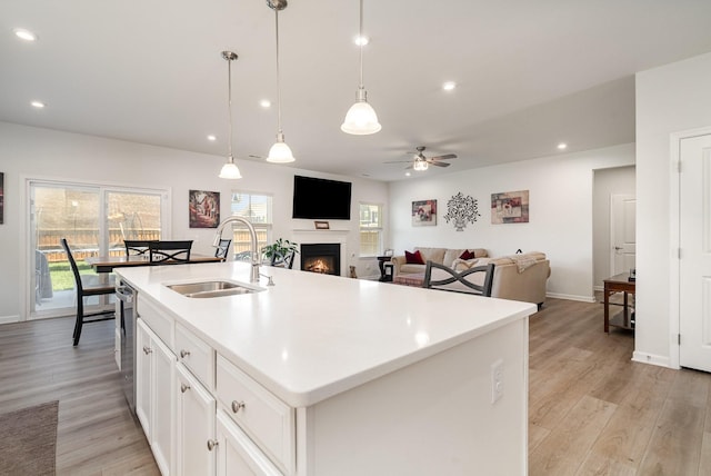 468 Rosy Dale Dr, Gallatin, TN 37066 - kitchen with a ceiling fan, a warm lit fireplace, healthy amount of natural light, light wood-type flooring, and recessed lighting
