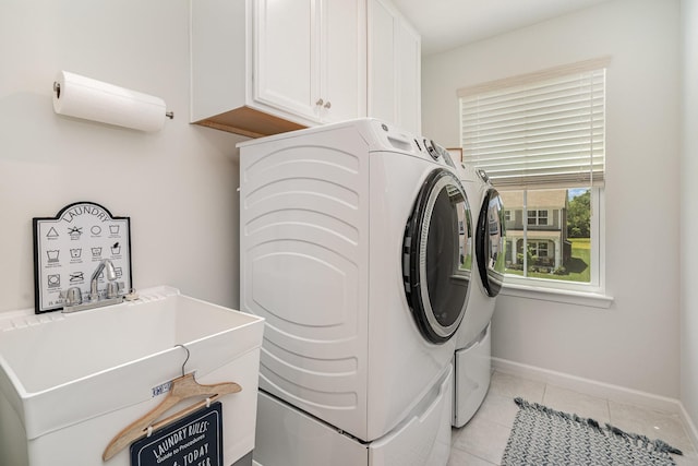 468 Rosy Dale Dr, Gallatin, TN 37066 - laundry room with washing machine and clothes dryer, cabinet space, and light tile patterned floors