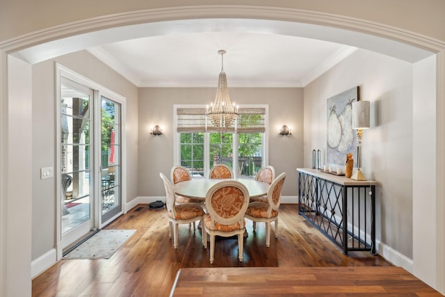 114 Middleton Cir, Nashville, TN 37215 - dining space with a chandelier, healthy amount of natural light, wood finished floors, arched walkways, and ornamental molding