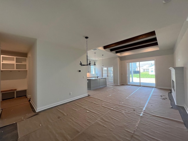 1720 Merkel Rd, Columbia, TN 38401 - unfurnished living room featuring beamed ceiling and a brick fireplace