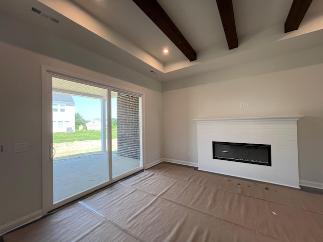 1720 Merkel Rd, Columbia, TN 38401 - unfurnished living room with beam ceiling, a glass covered fireplace, and recessed lighting