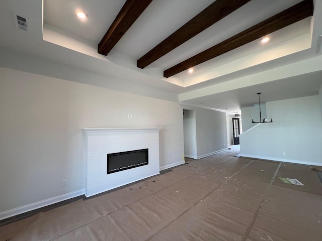 1720 Merkel Rd, Columbia, TN 38401 - unfurnished living room with a chandelier, a glass covered fireplace, and beam ceiling