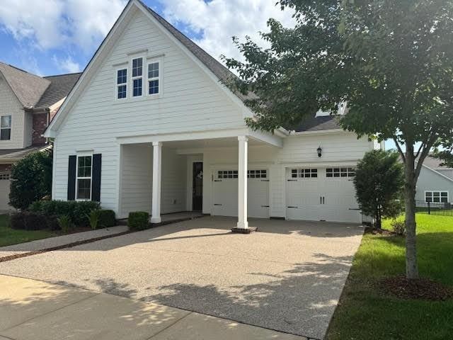 2013 Braun Dr, Franklin, TN 37064 - view of front facade featuring driveway and a garage