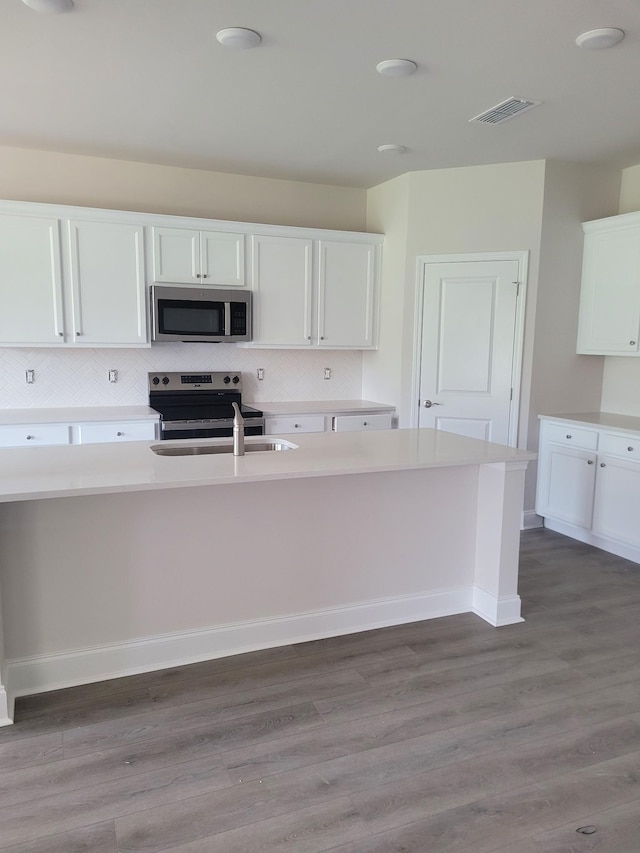 120 Holly Rdg, Antioch, TN 37013 - kitchen featuring stainless steel appliances, white cabinets, and light countertops
