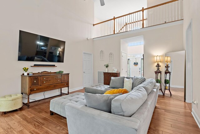 604 Applejack Ct, Antioch, TN 37013 - living area featuring wood finished floors, a towering ceiling, and ceiling fan
