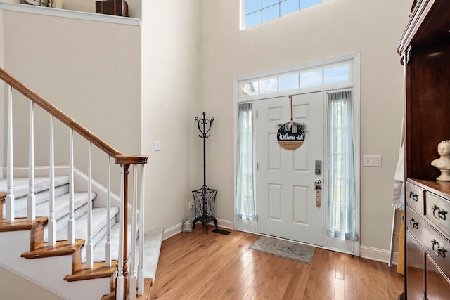 604 Applejack Ct, Antioch, TN 37013 - entrance foyer featuring light wood-style flooring, stairs, and a high ceiling
