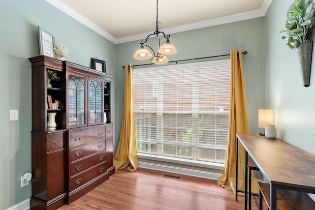 604 Applejack Ct, Antioch, TN 37013 - dining space featuring crown molding, wood finished floors, and a chandelier