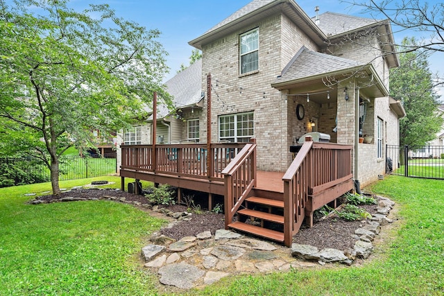 604 Applejack Ct, Antioch, TN 37013 - back of house featuring roof with shingles, brick siding, and a wooden deck