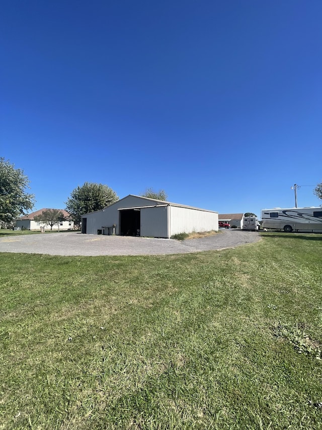 1021 Maple Grove Rd, Lafayette, TN 37083 - view of side of property with an outbuilding, a yard, and an outdoor structure