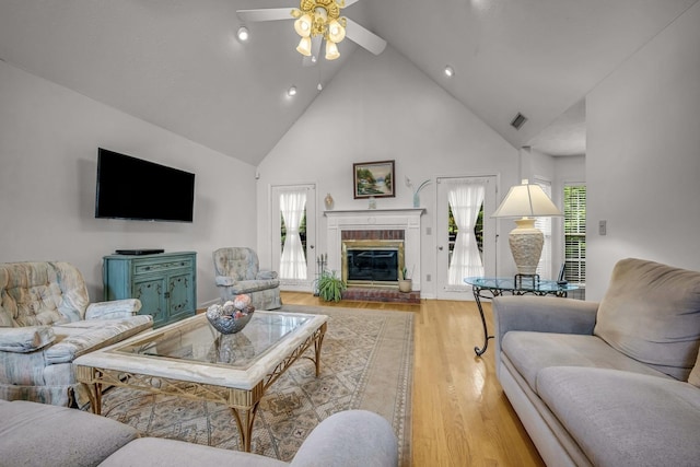 1013 Laurel Hills Dr, Dickson, TN 37055 - living area featuring high vaulted ceiling, a ceiling fan, light wood-style floors, a fireplace, and recessed lighting