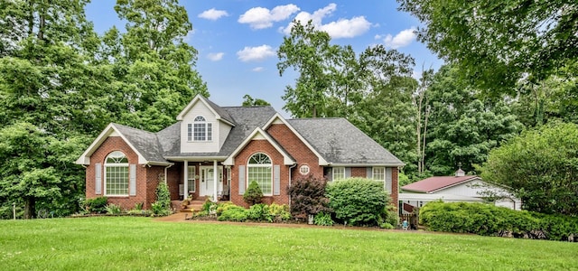 1013 Laurel Hills Dr, Dickson, TN 37055 - traditional-style house featuring brick siding, a front lawn, and a shingled roof