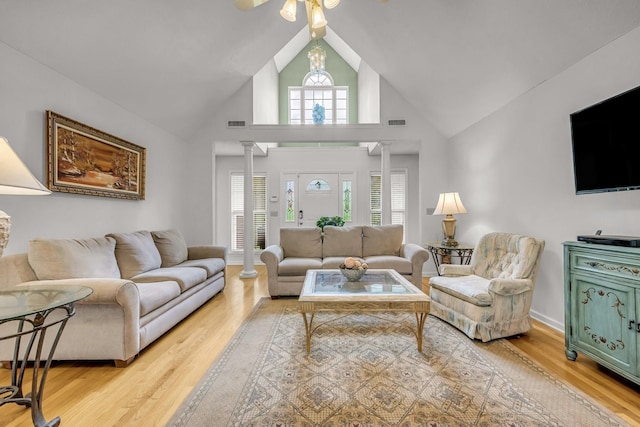 1013 Laurel Hills Dr, Dickson, TN 37055 - living area featuring ornate columns, wood finished floors, high vaulted ceiling, and a ceiling fan