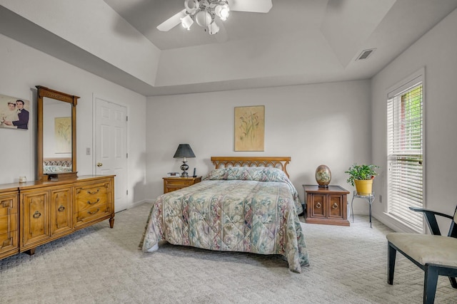 1013 Laurel Hills Dr, Dickson, TN 37055 - bedroom with light colored carpet, a tray ceiling, and ceiling fan
